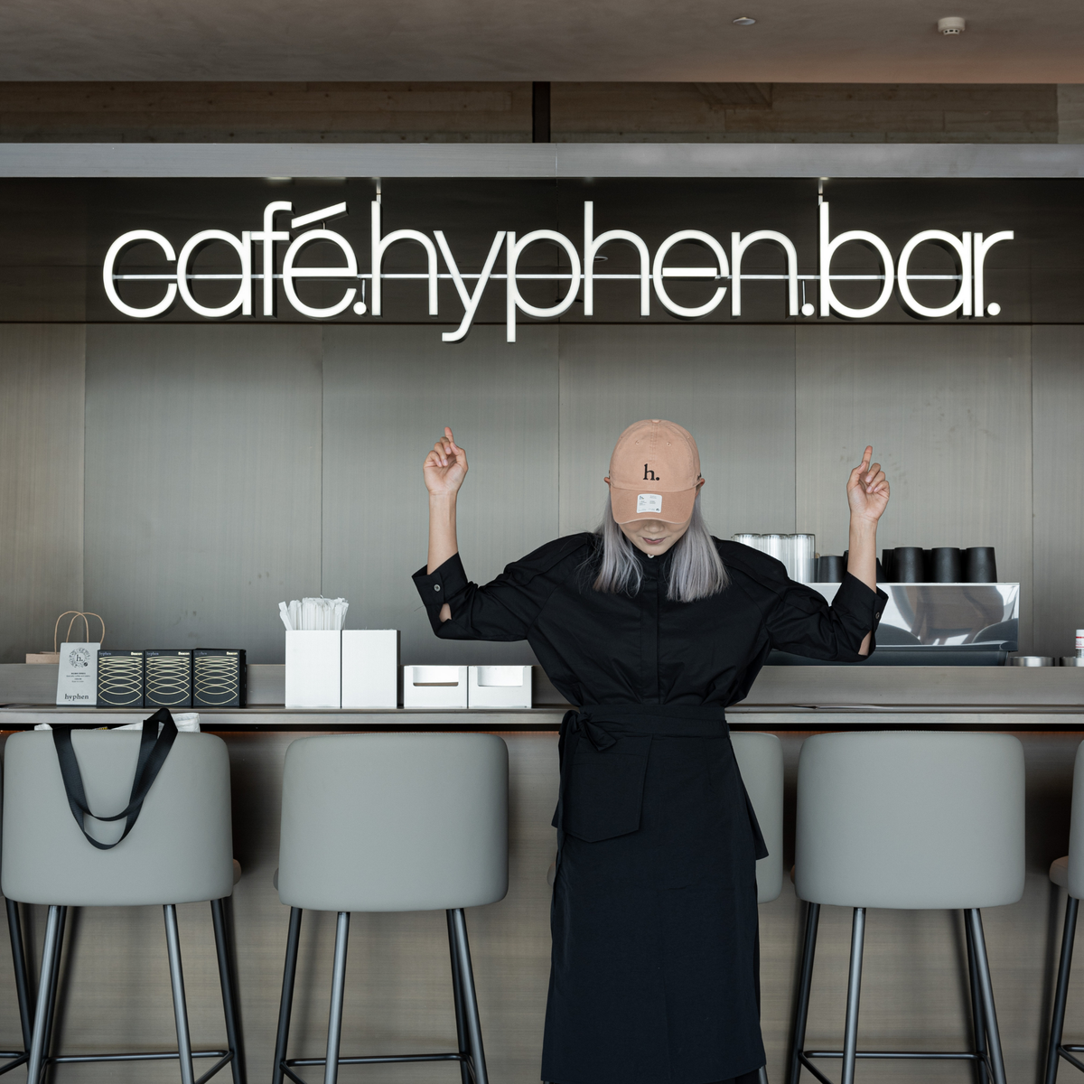 Outdoor seating and glass frontage at hyphen. Aranya, Lanxi Hotel, Qinhuangdao